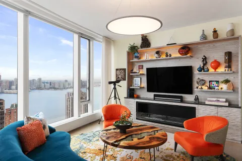 a room with furniture and a flat screen tv