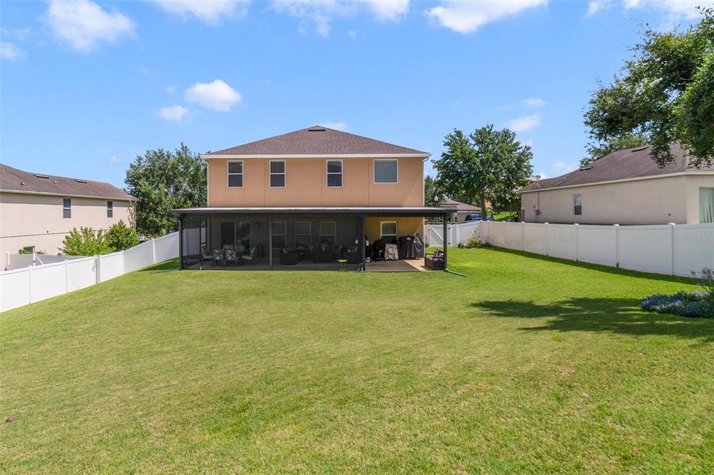 352 Giovani Boulevard Clermont, FL 34715 - Photo 3 of 46 a front view of a house with a yard and garage