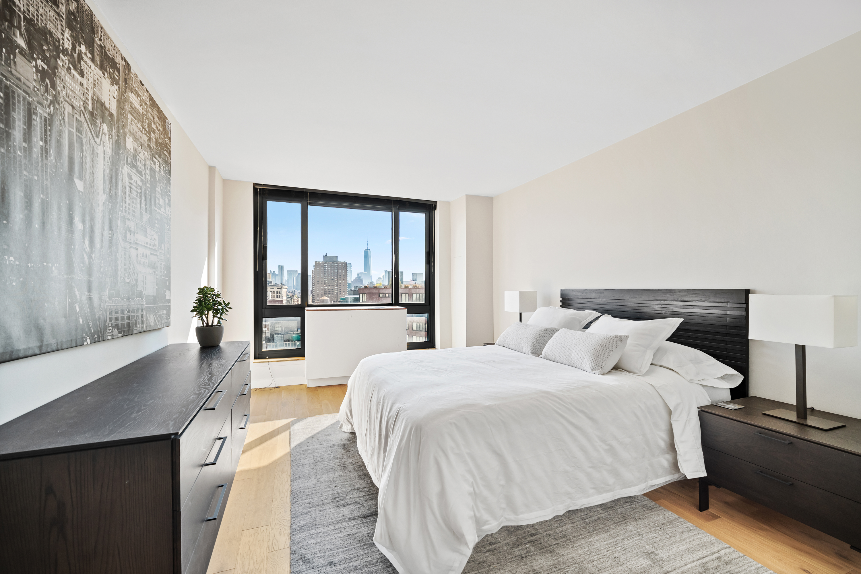 1 Irving Place, Unit U21E Manhattan, NY 10003 - Photo 7 of 9 a bedroom with a large bed and a large window