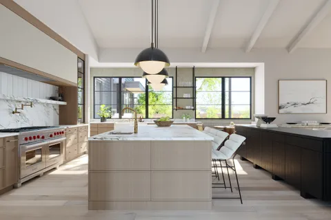 a large kitchen with a table and chairs