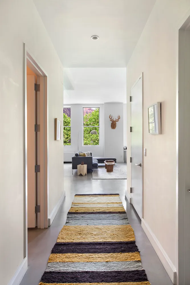 a view of a patio with a table and chairs