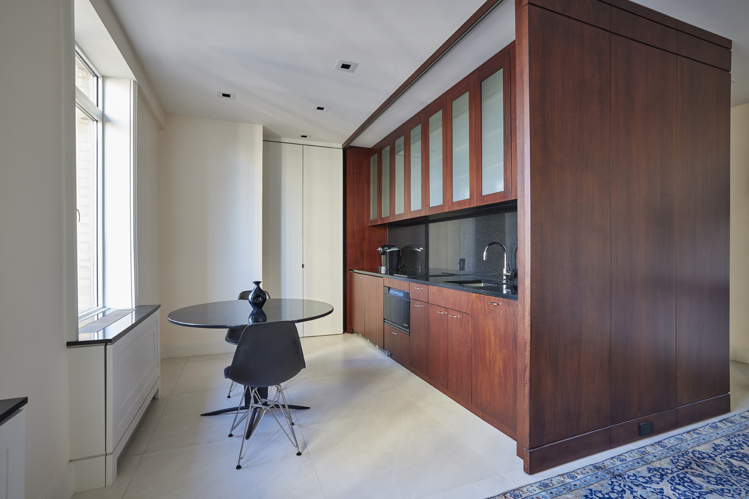 115 Central Park West, Unit 18JK Manhattan, NY 10023 - Photo 13 of 25 a view of a hallway with workspace and windows