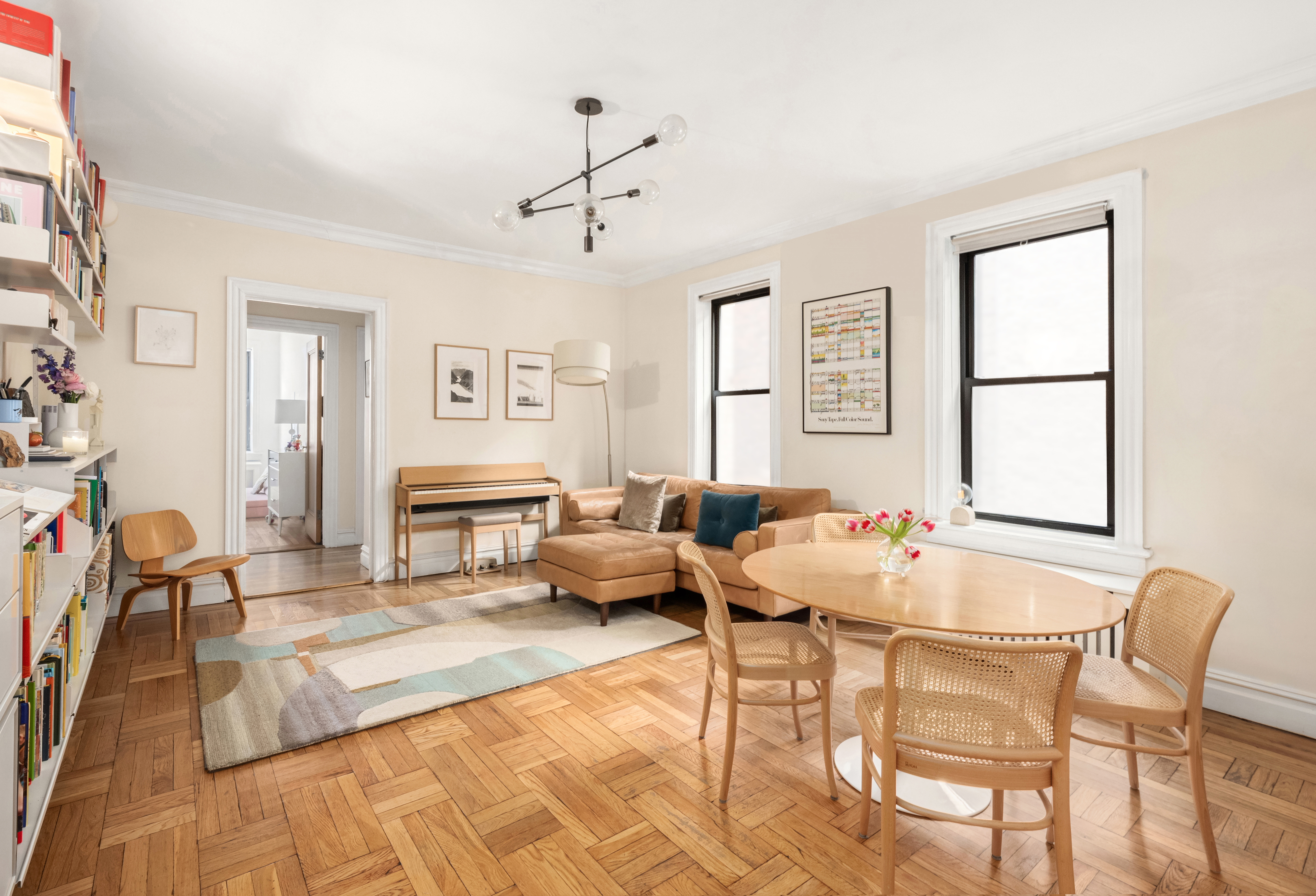 205 East 10th Street, Unit 3A Manhattan, NY 10003 - Photo 1 of 13 a living room with furniture and wooden floor