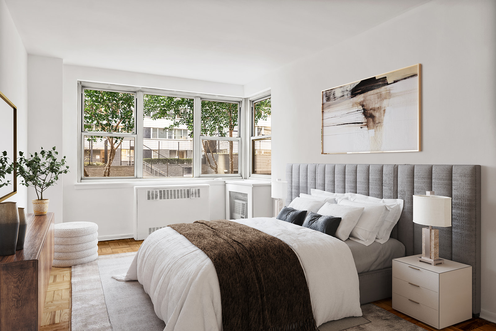 233 East 69th Street, Unit 2C Manhattan, NY 10021 - Photo 2 of 10 a bedroom with a bed and a large window