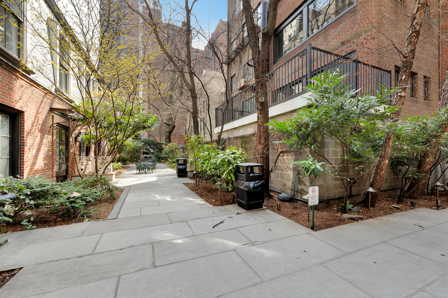 219 East 49th Street Manhattan, NY 10017 - Photo 17 of 19 a view of a pathway with a yard
