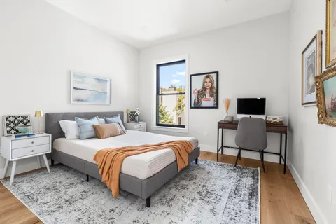 a bedroom with a bed and a couch