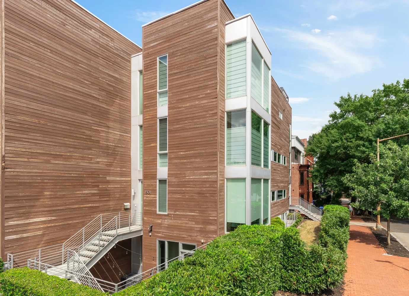 a view of a door with brick walls