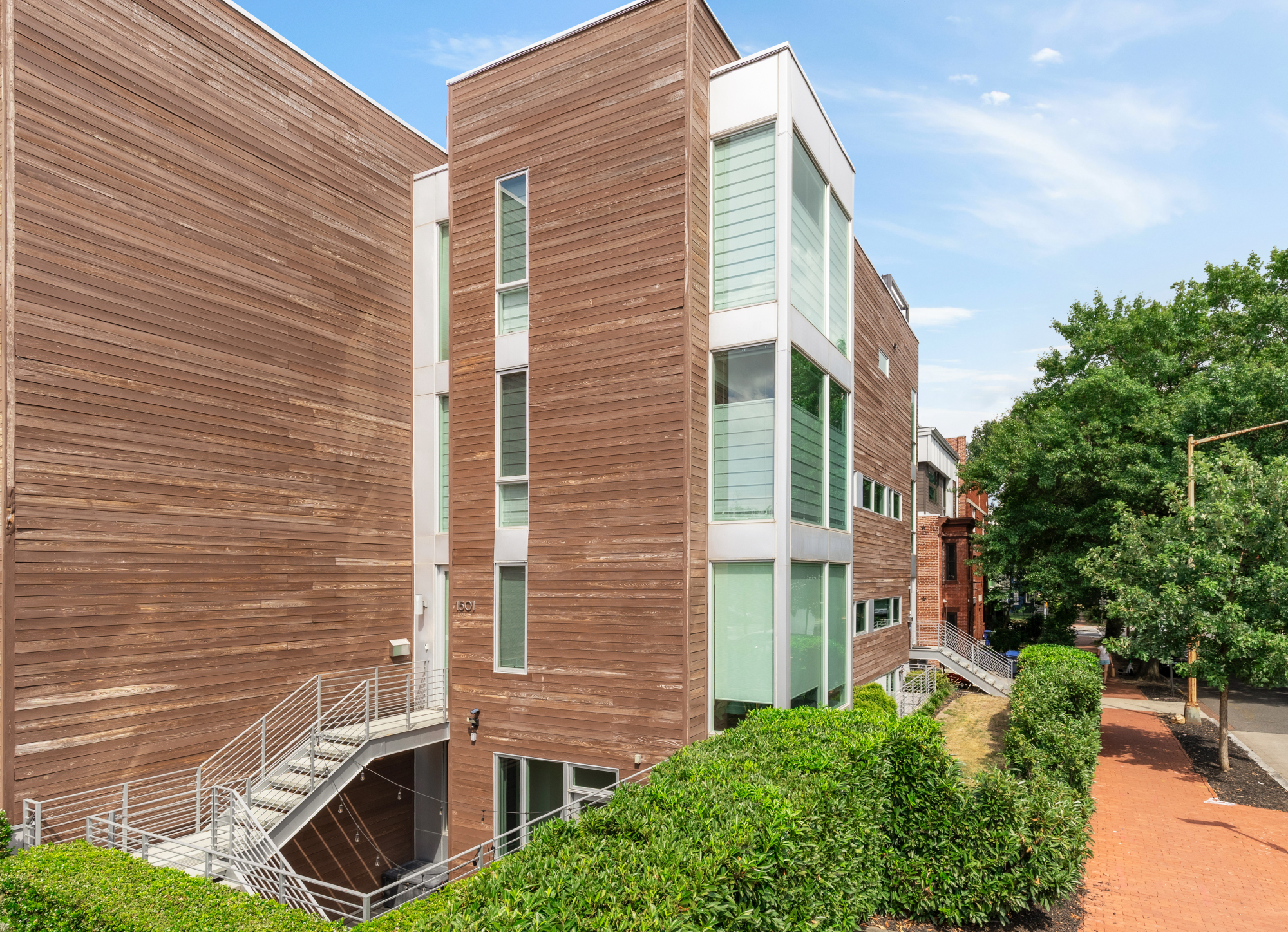 a view of a door with brick walls