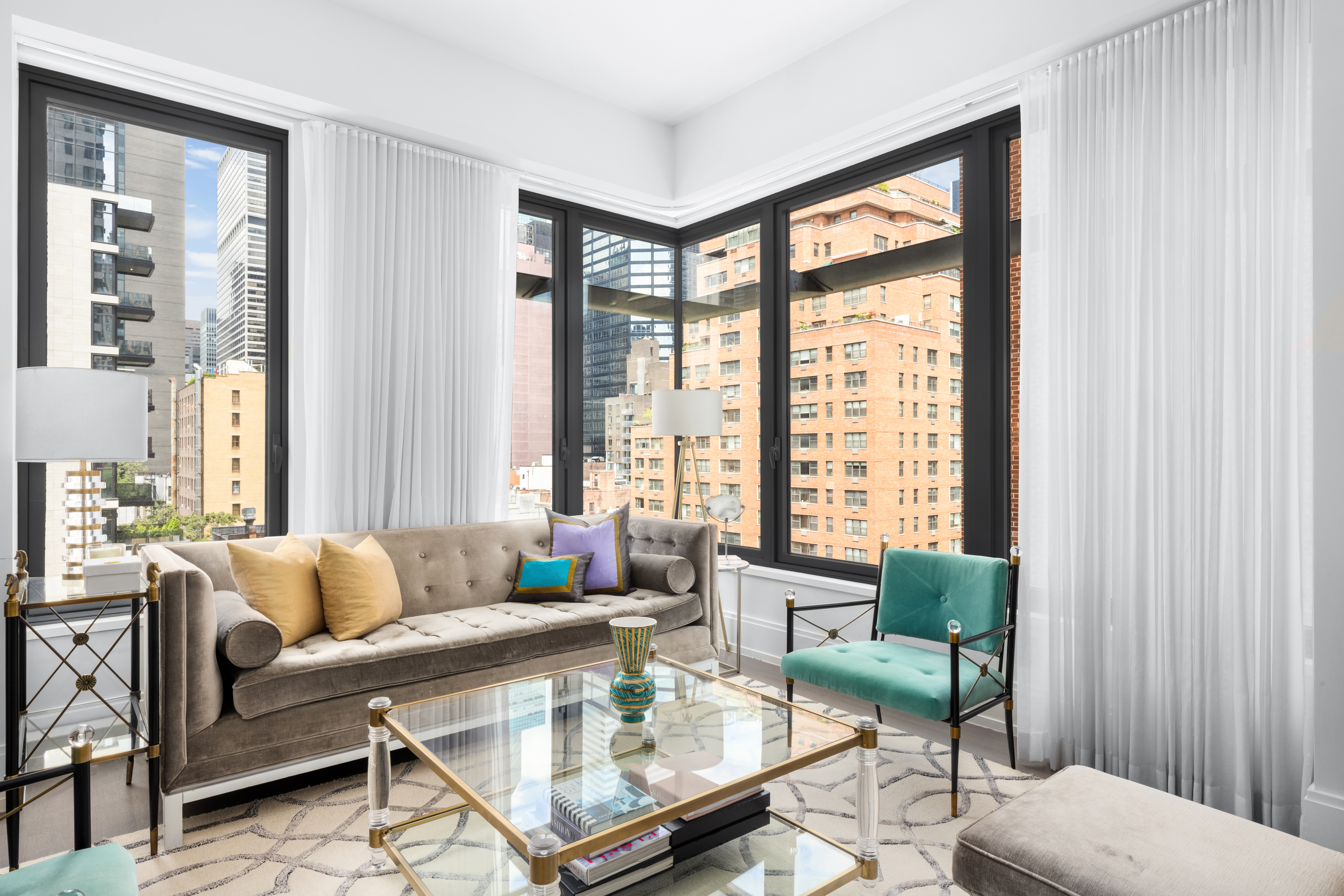301 East 50th Street, Unit 8C Manhattan, NY 10022 - Photo 3 of 20 a living room with furniture and a large window