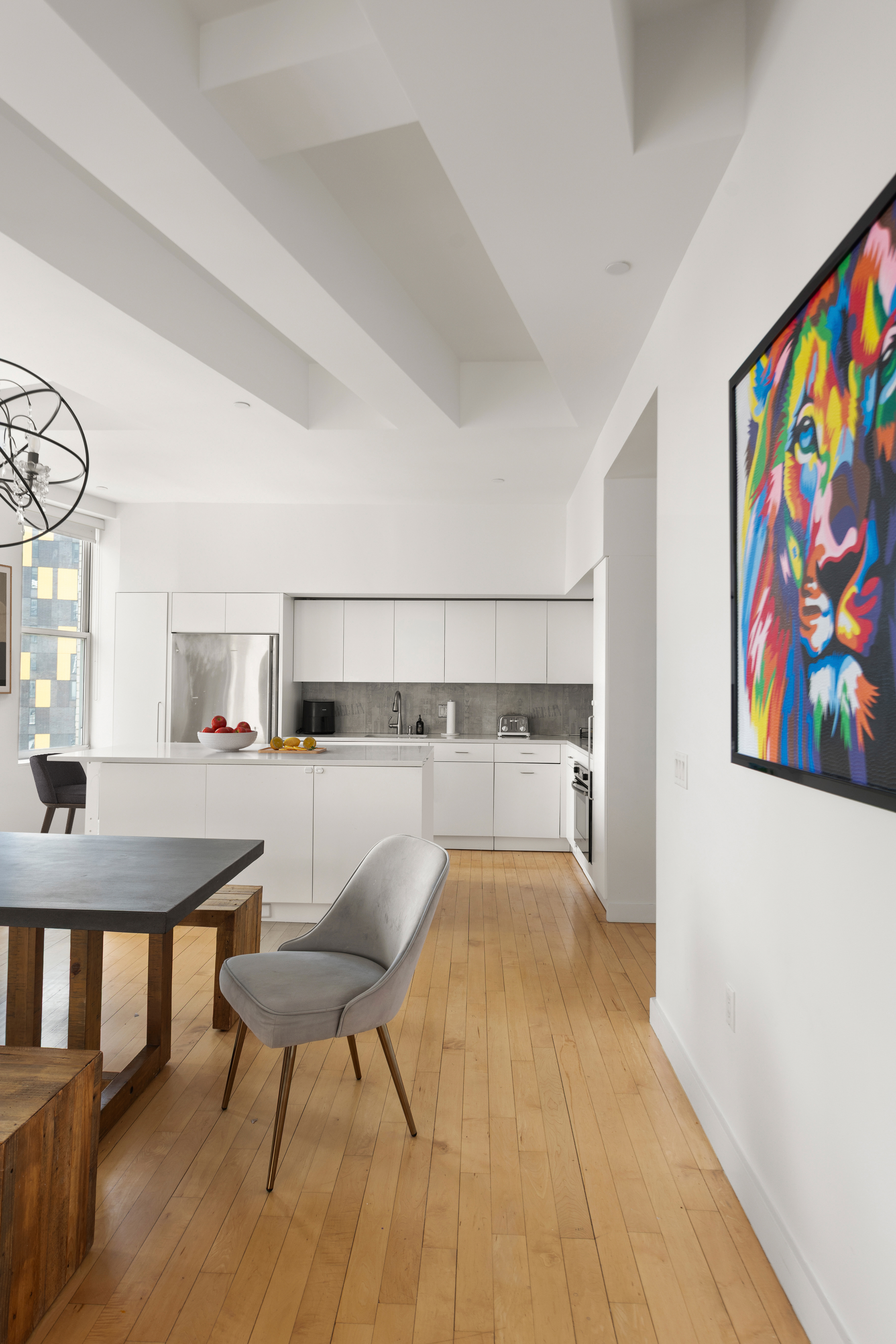 15 Broad Street, Unit 3100 Manhattan, NY 10005 - Photo 3 of 27 a view of a dining room with furniture and wooden floor