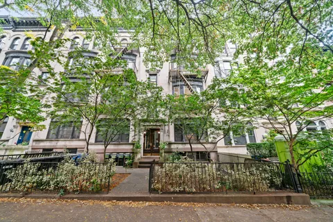 a view of a building with a tree
