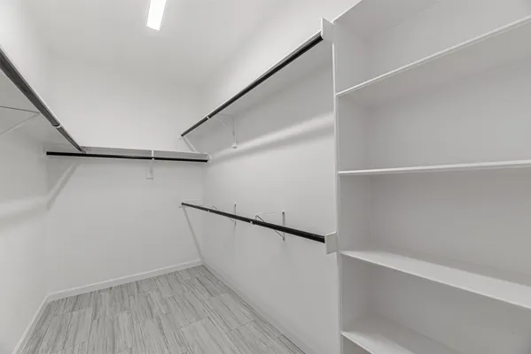 a view of an empty walk in closet