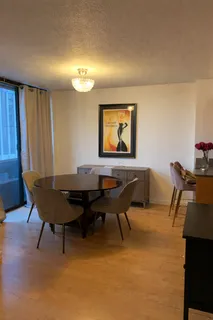 a view of a workspace with furniture