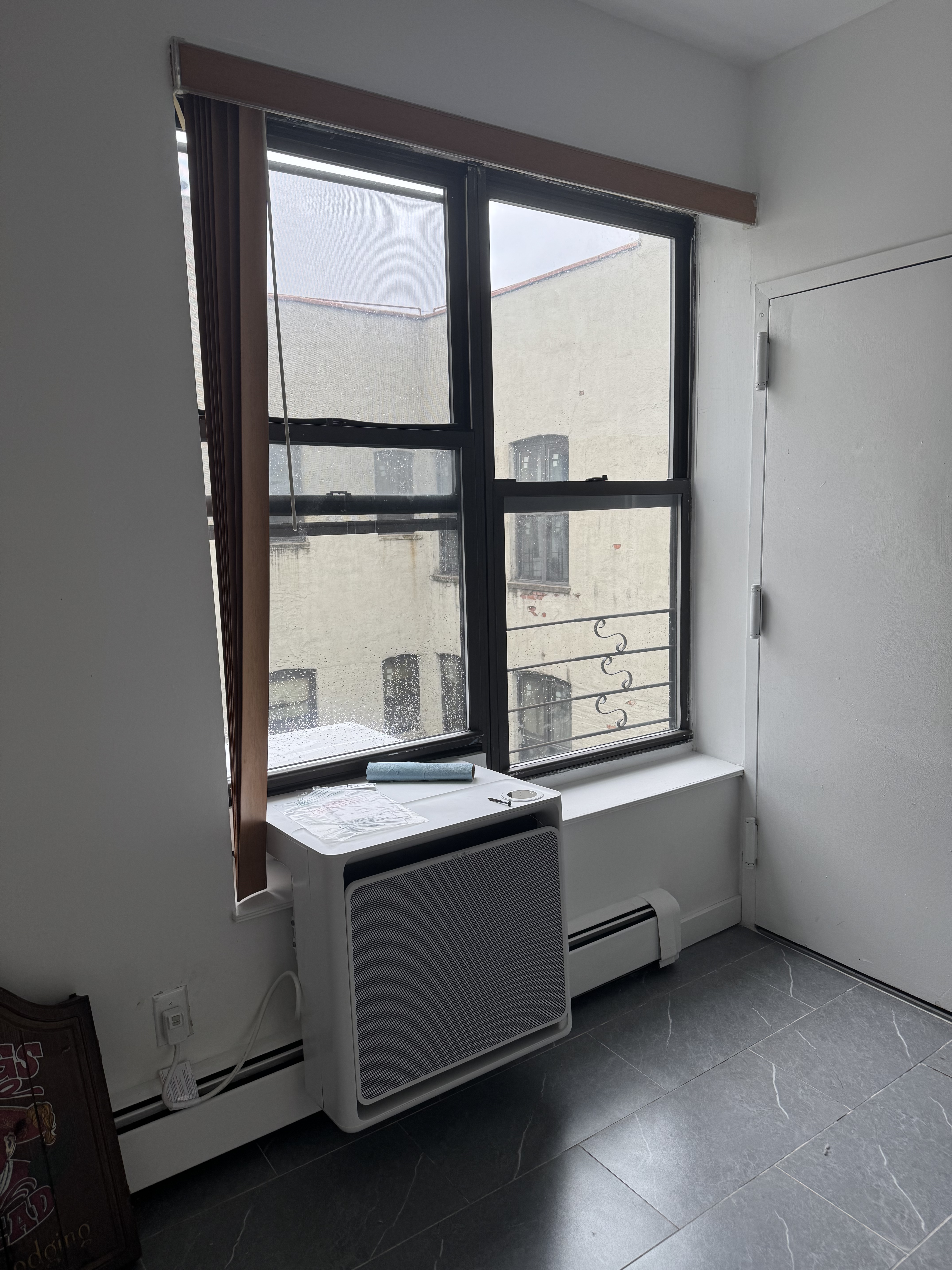 149 Sterling Street, Unit 4D Brooklyn, NY 11225 - Photo 2 of 7 a view of room with window and cabinet