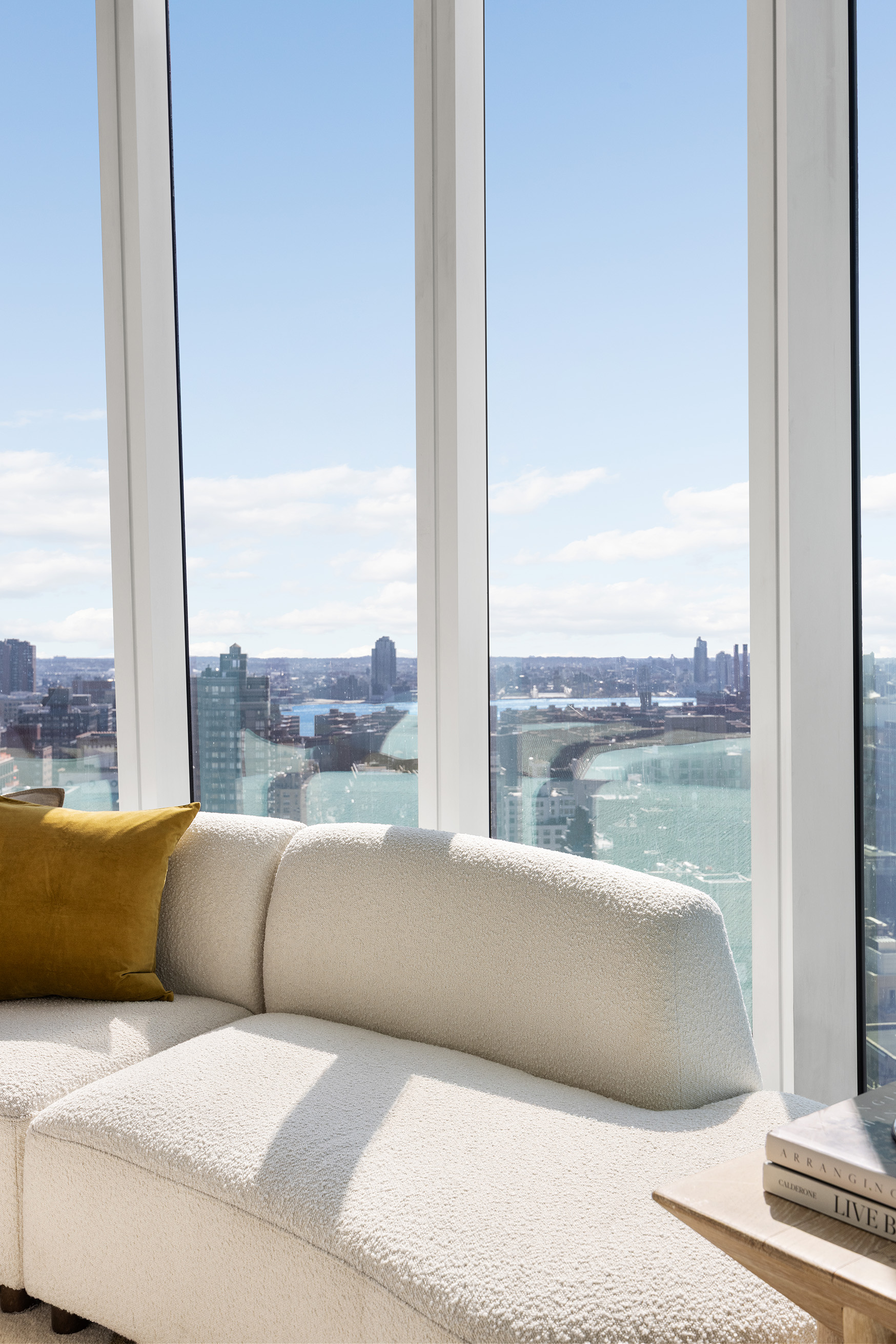 45 East 22nd Street, Unit 32B Manhattan, NY 10010 - Photo 22 of 36 a living room with a couch and large window