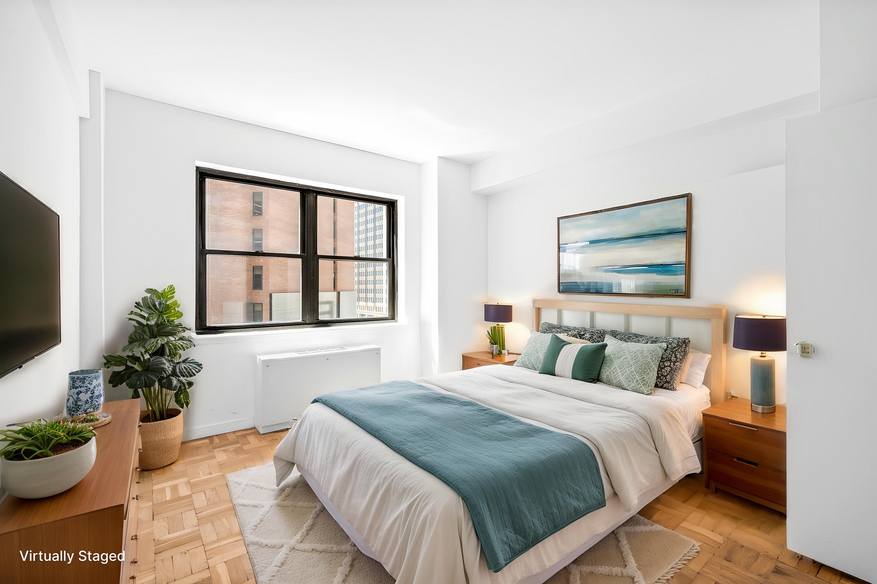 7 Park Avenue, Unit 66 Manhattan, NY 10016 - Photo 7 of 11 a bedroom with a large bed and a potted plant