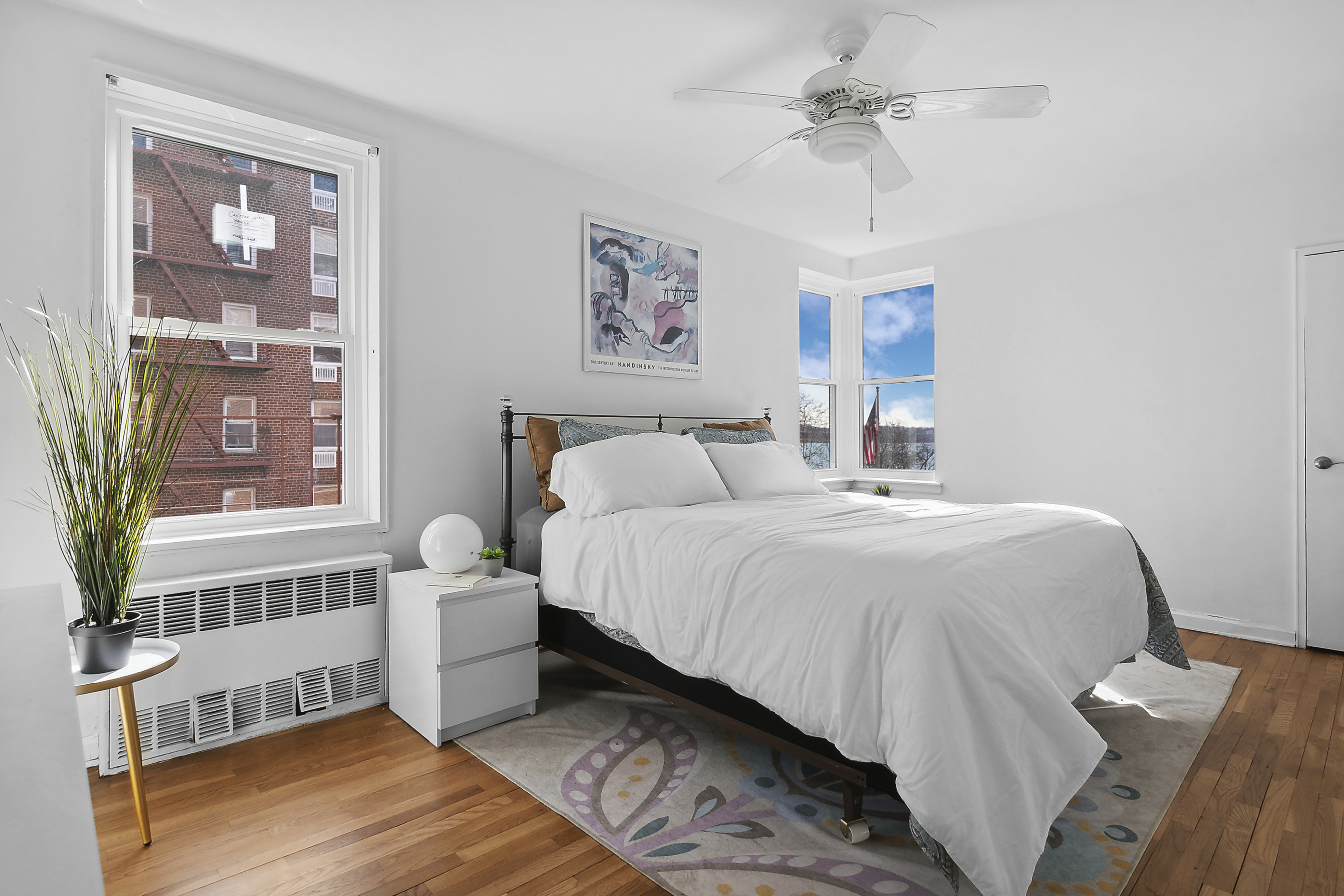 9201 Shore Road, Unit B301 Brooklyn, NY 11209 - Photo 3 of 12 a bedroom with a bed and a window