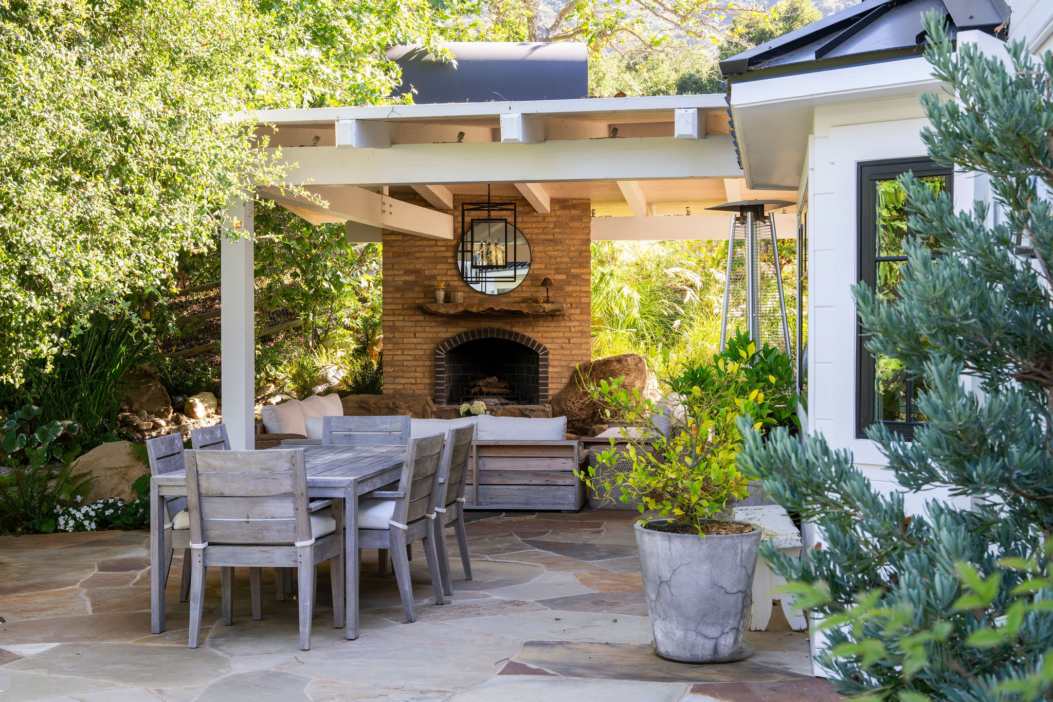 560 Cold Canyon Road Calabasas, CA 91302 - Photo 70 of 84 a dining table with chairs and a potted plant