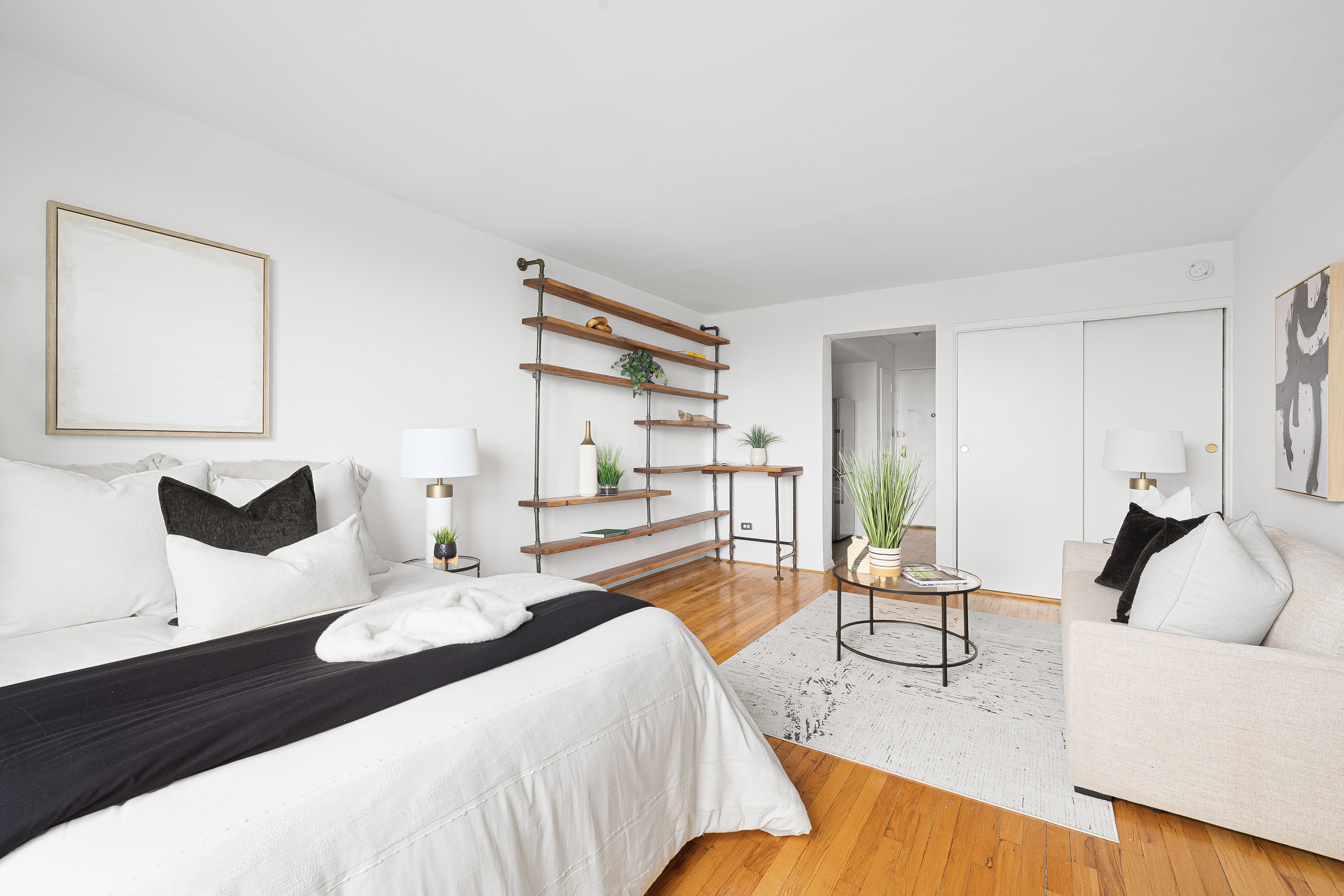 50-21 39th Place, Unit 6D Queens, NY 11104 - Photo 9 of 15 a living room with furniture and a table