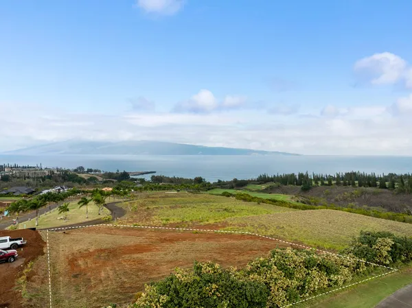a view of an ocean and city