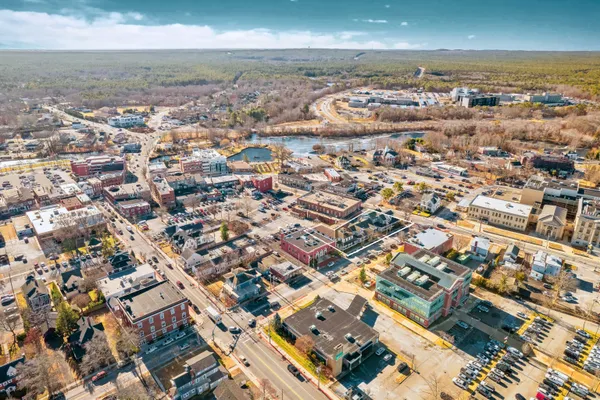 an aerial view of residential building with parking