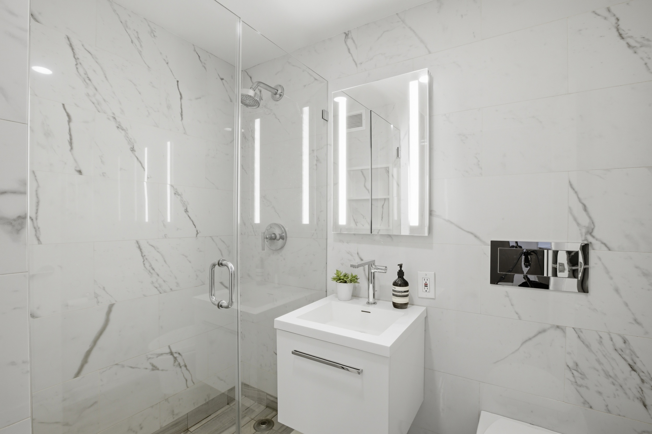 175 West 95th Street, Unit 8H Manhattan, NY 10025 - Photo 9 of 13 a bathroom with a sink toilet and vanity