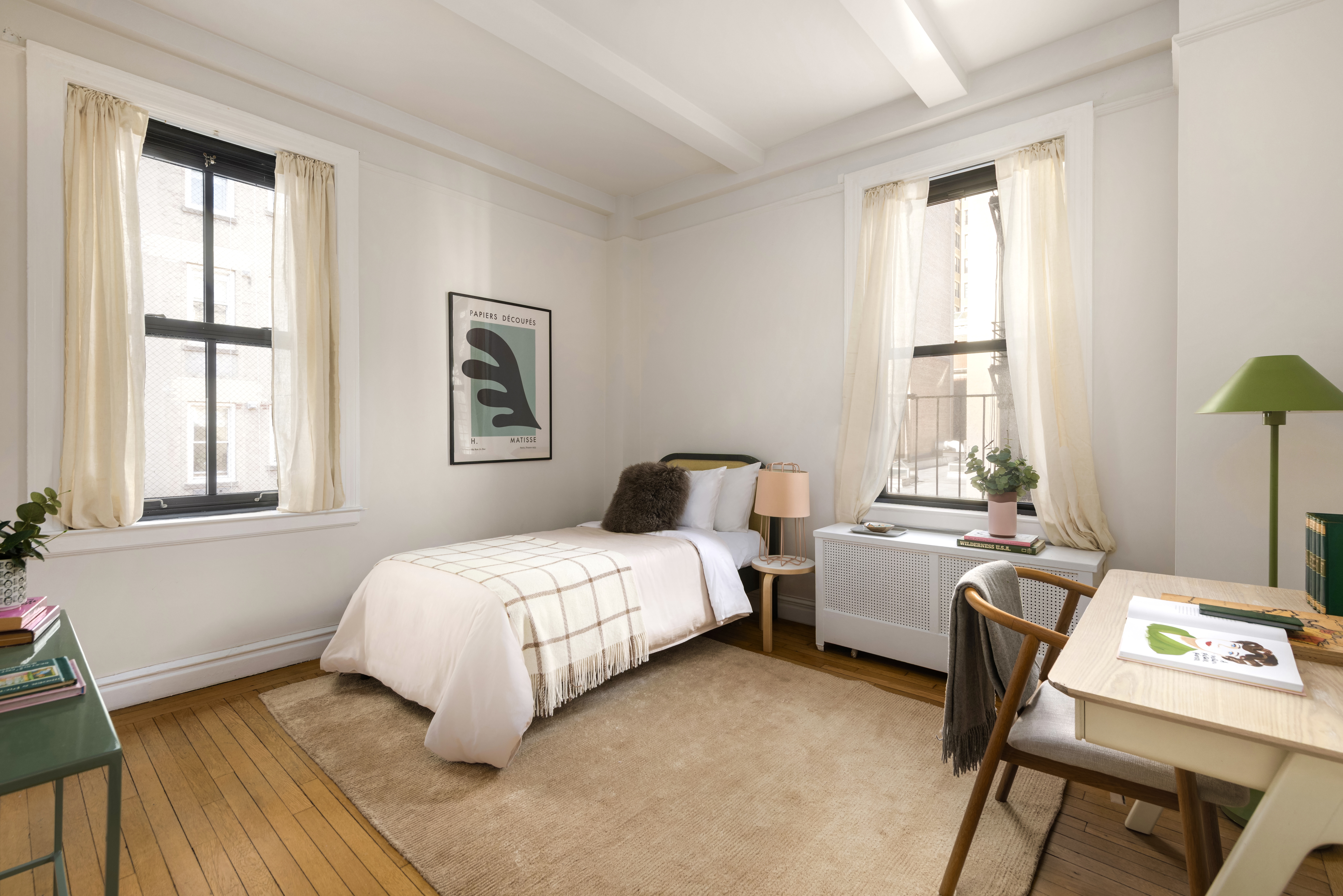 115 East 90th Street, Unit 4E Manhattan, NY 10128 - Photo 6 of 9 a bedroom with a bed and a window