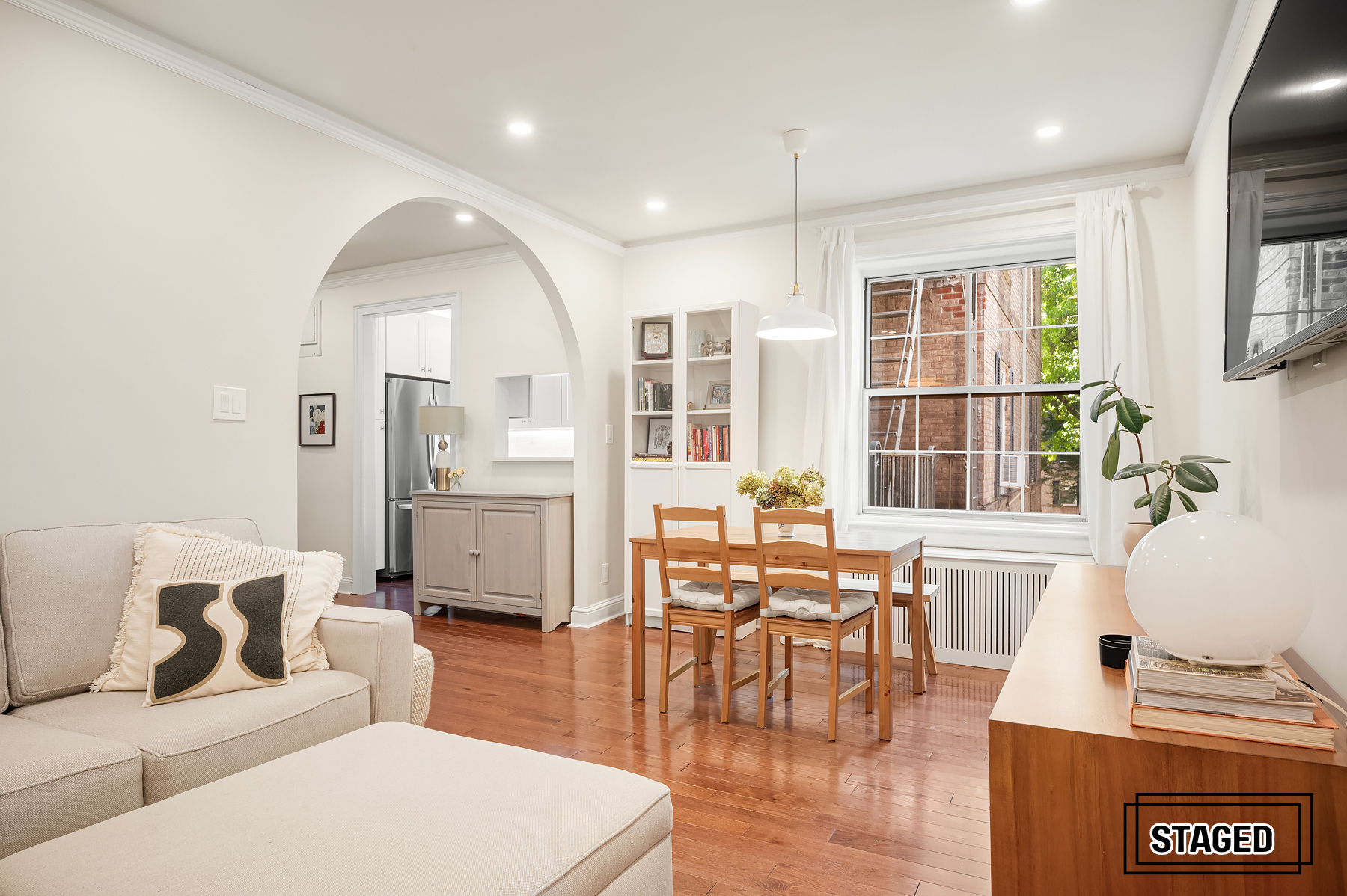 30-31 Hobart Street, Unit 3L Queens, NY 11377 - Photo 8 of 14 a living room with furniture and wooden floor