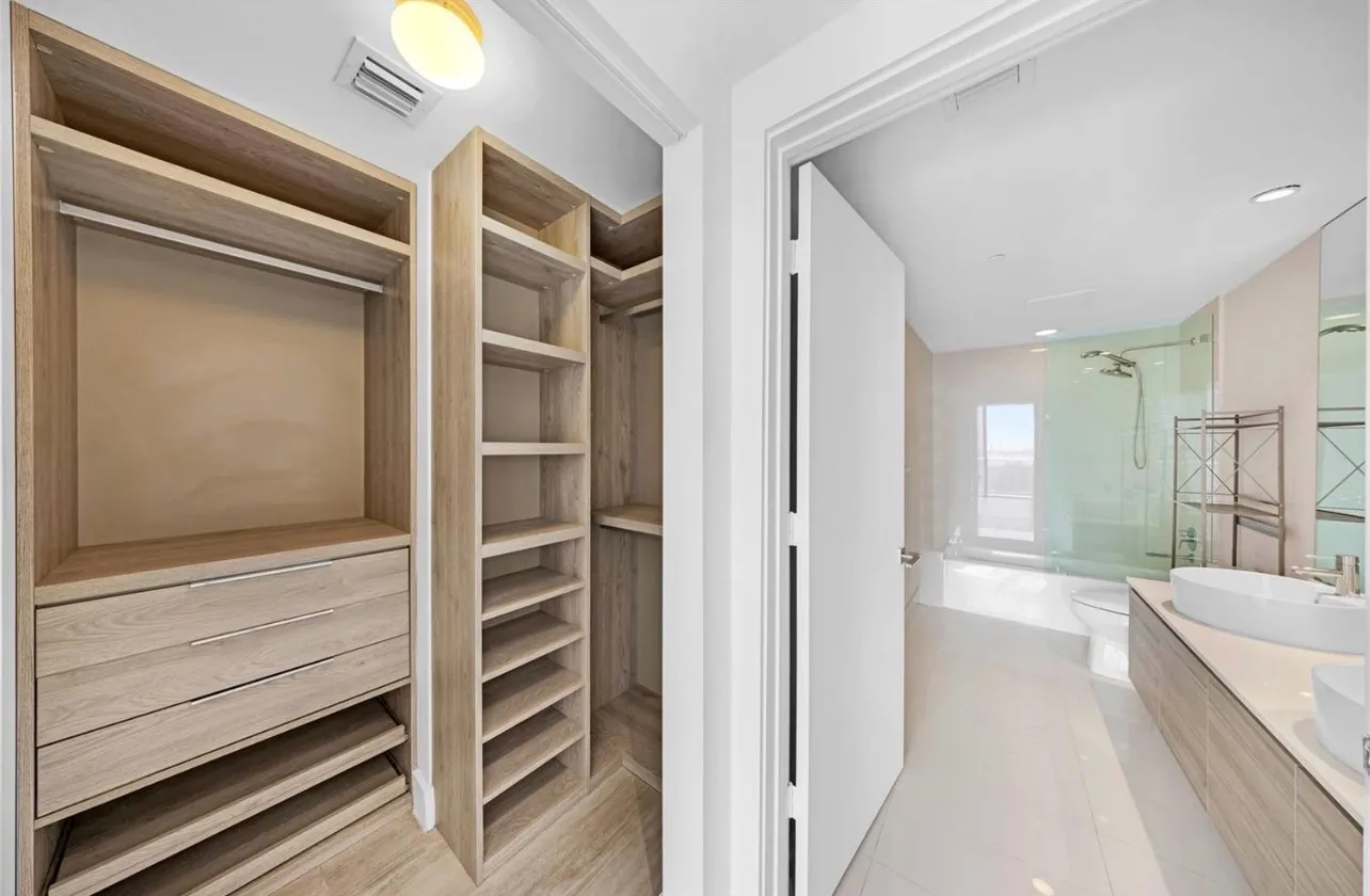 a bathroom with a bathtub and a shower