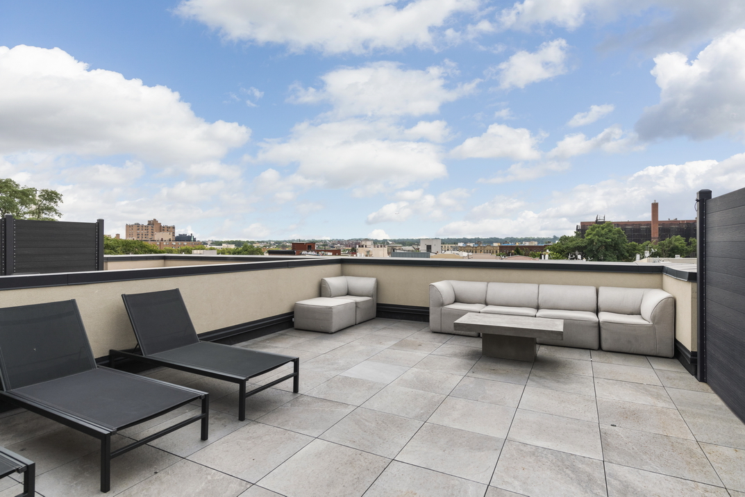 1164 Greene Avenue, Unit PHB Brooklyn, NY 11221 - Photo 13 of 16 a terrace with outdoor seating and barbeque