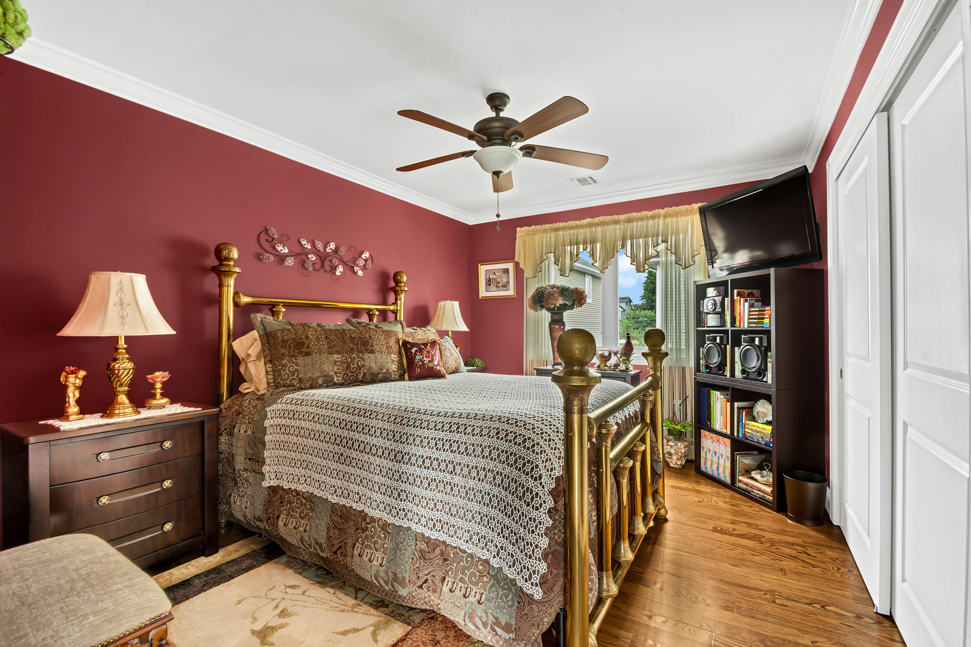 909 Jewett Avenue Staten Island, NY 10314 - Photo 27 of 65 a bedroom with a bed and a chandelier