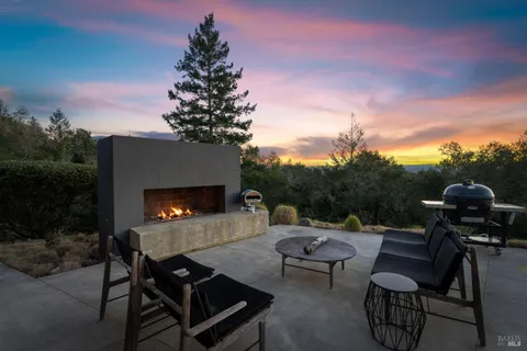 a view of a couches and a table in the terrace