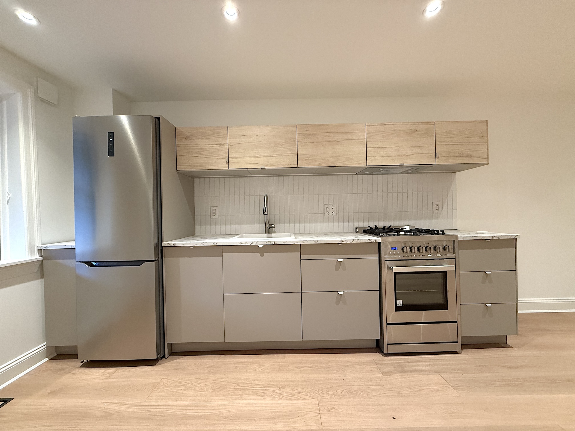 424 Pacific Street, Unit GARDEN Brooklyn, NY 11217 - Photo 5 of 16 a kitchen with a stove cabinets and a refrigerator