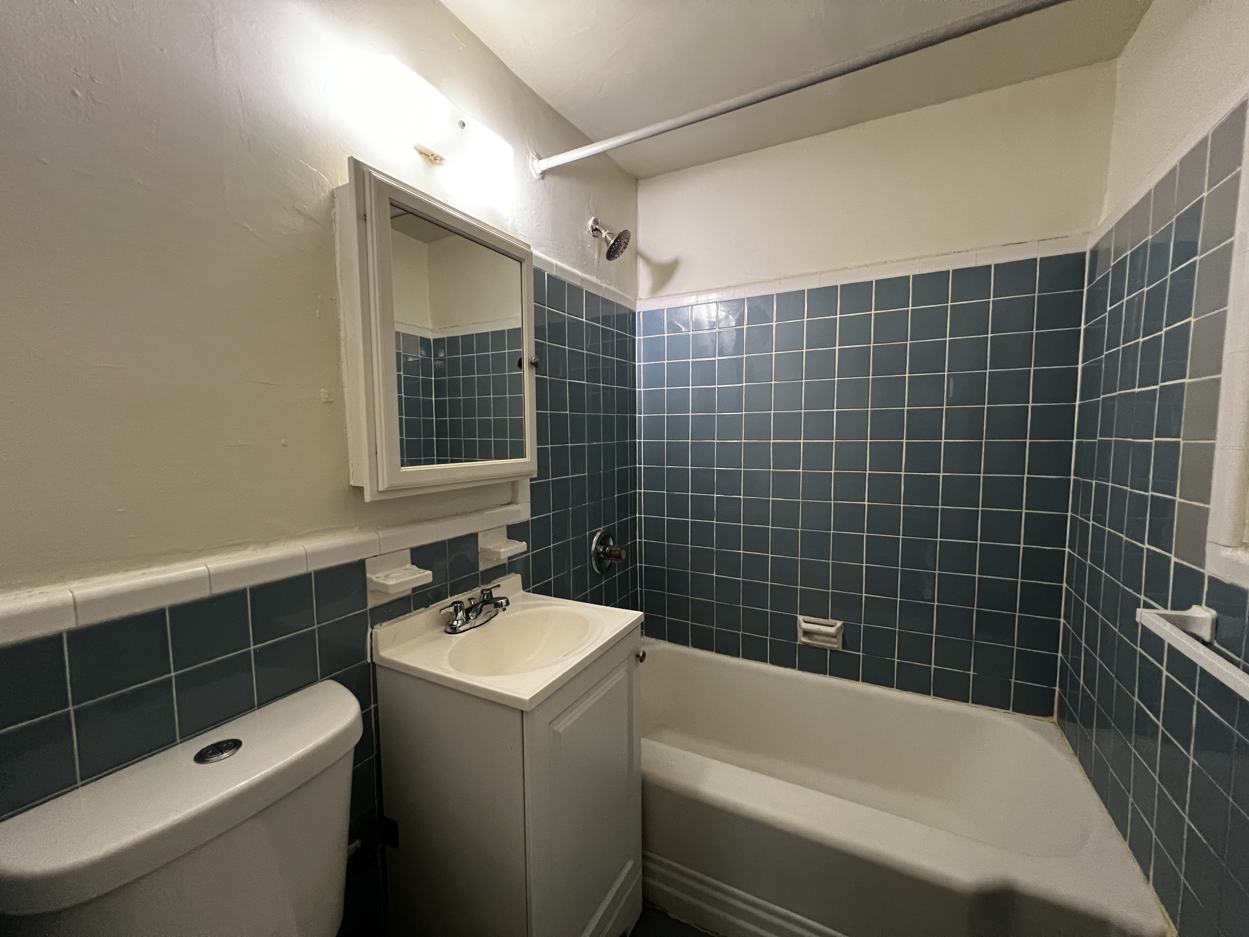 151 East 43rd Street, Unit 4B Manhattan, NY 10017 - Photo 6 of 7 a bathroom with a sink toilet and shower