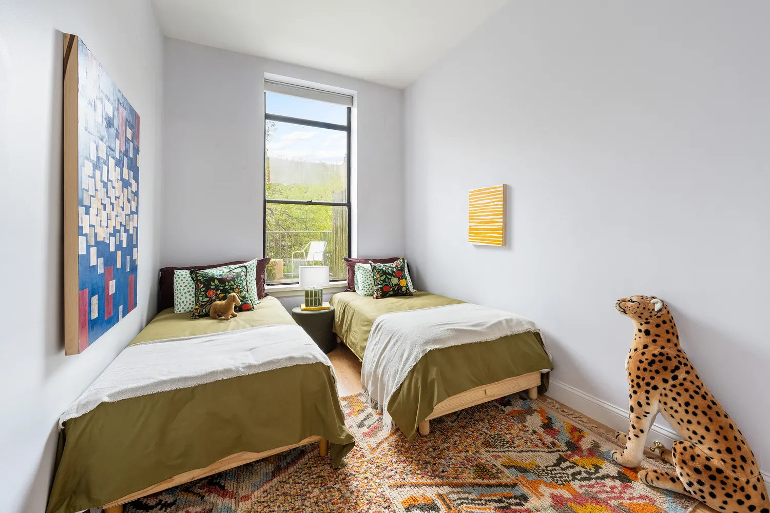 a bedroom with double bed and a window