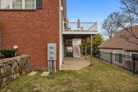 a view of a house with a porch and furniture