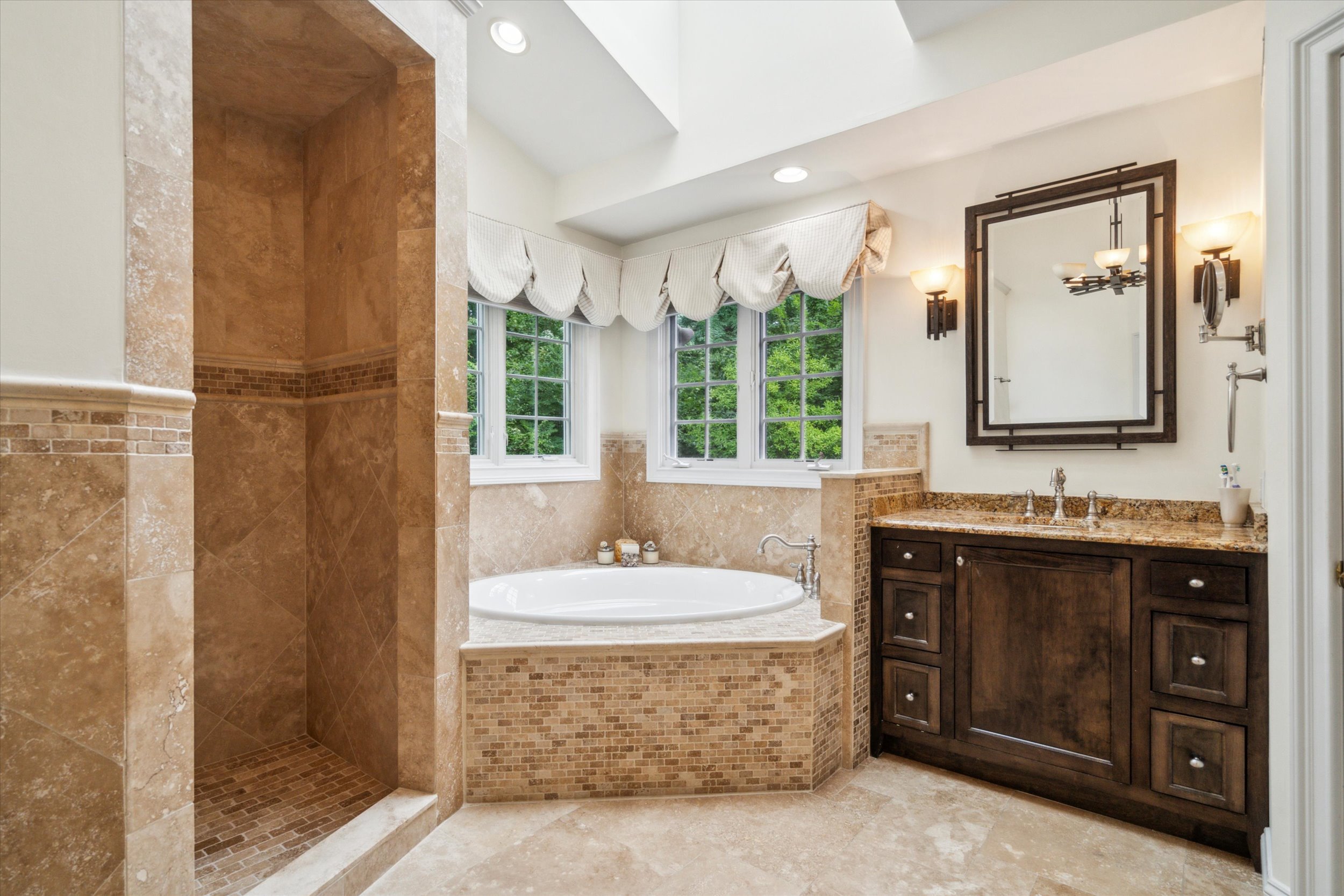 145 Biddulph Road Wayne, PA 19087 - Photo 21 of 39 a spacious bathroom with a tub sink and mirror