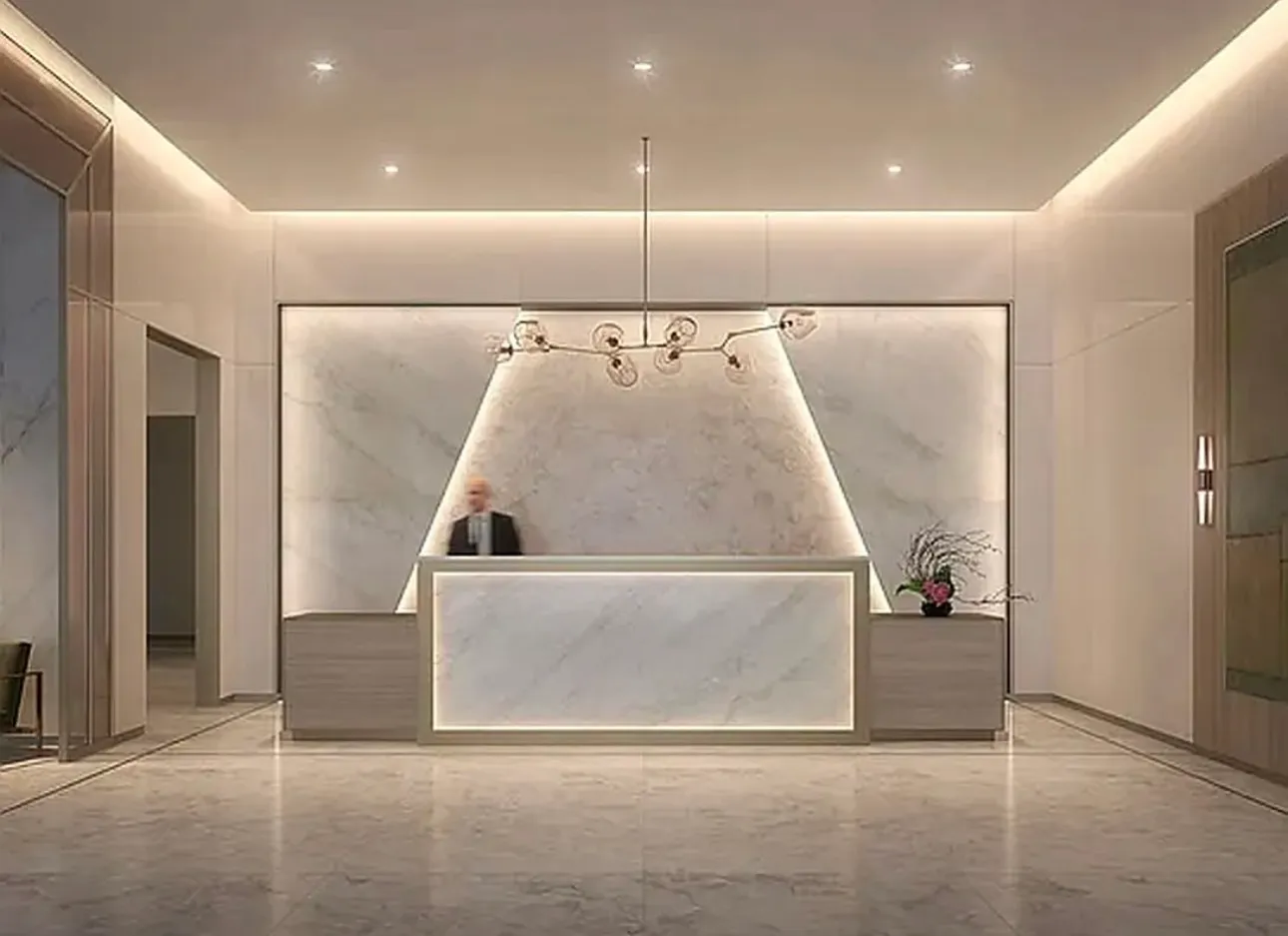 a living room with couches and kitchen view with wooden floor