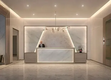 a living room with couches and kitchen view with wooden floor