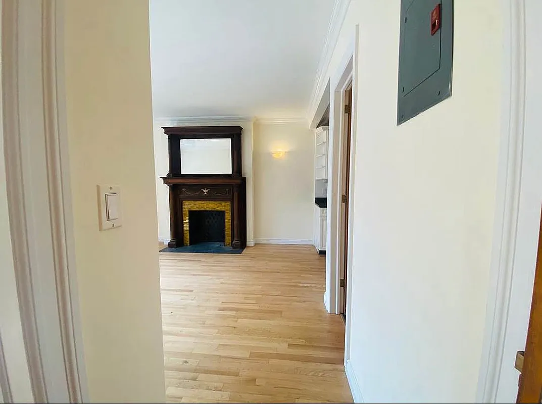 305 West 91st Street, Unit 4F Manhattan, NY 10024 - Photo 5 of 11 a view of an empty room with a fireplace