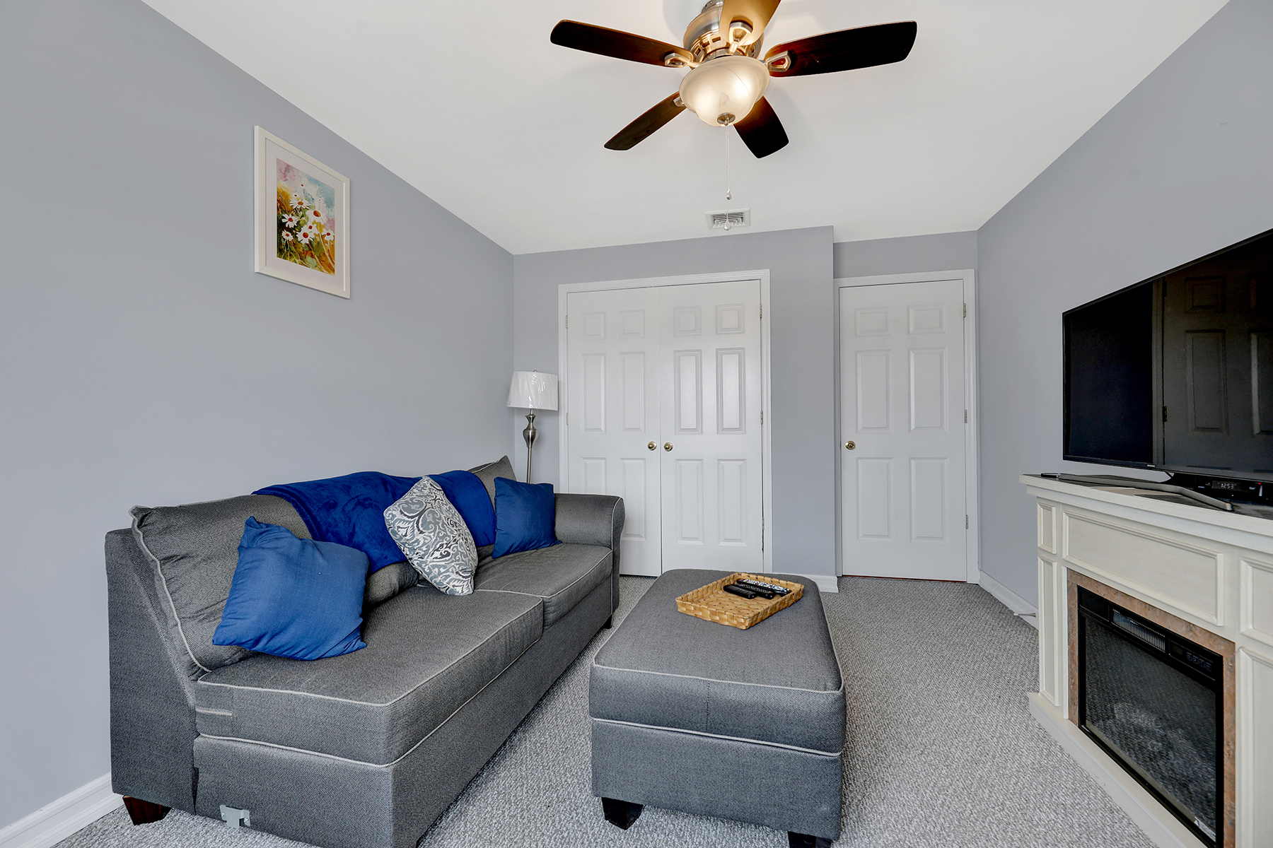 102-20 Rockaway Beach Boulevard, Unit 3C Queens, NY 11694 - Photo 21 of 36 a living room with furniture and a flat screen tv