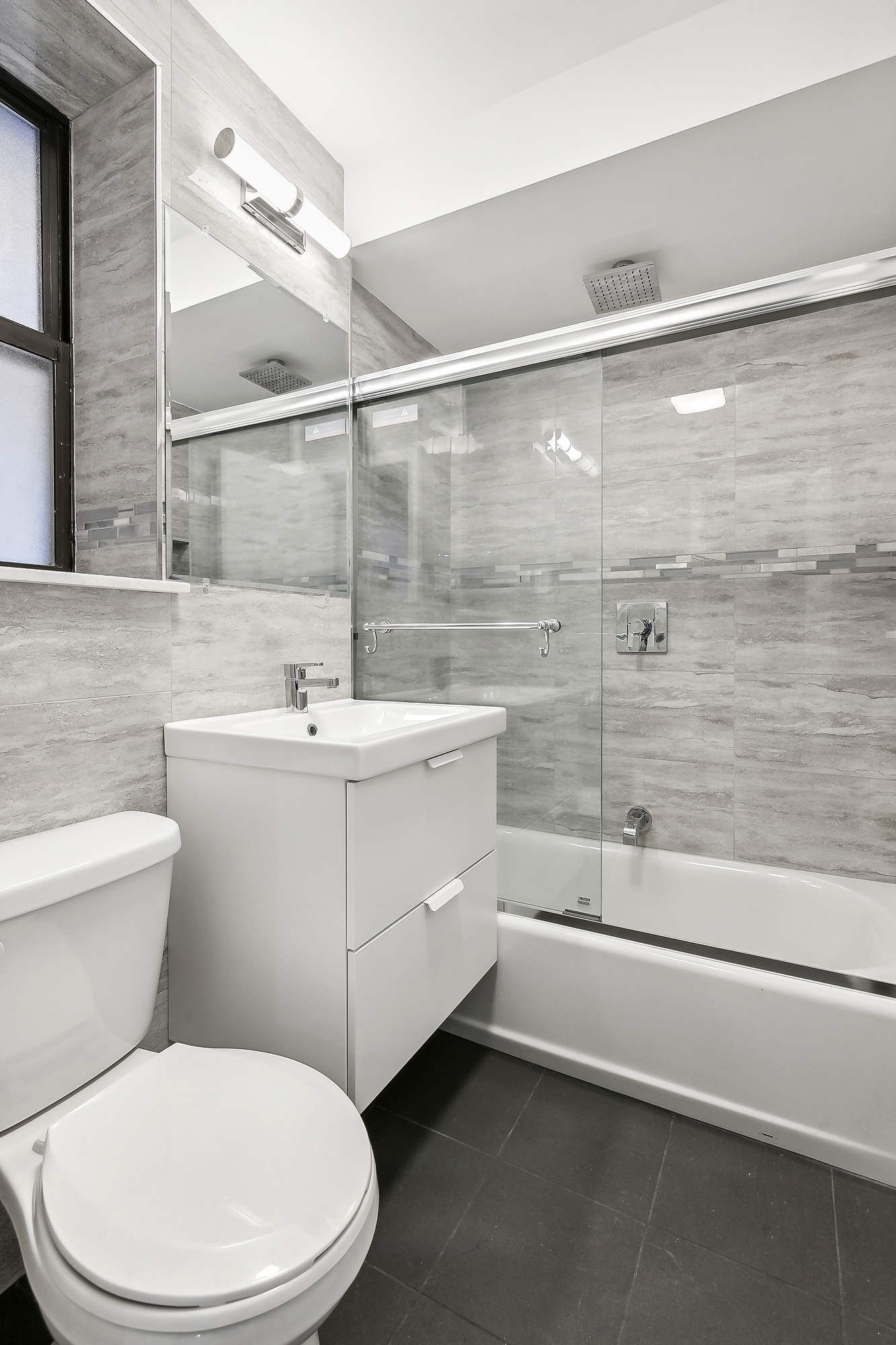 40 89th Street, Unit 1F Brooklyn, NY 11209 - Photo 9 of 13 a bathroom with a sink a toilet and bathtub