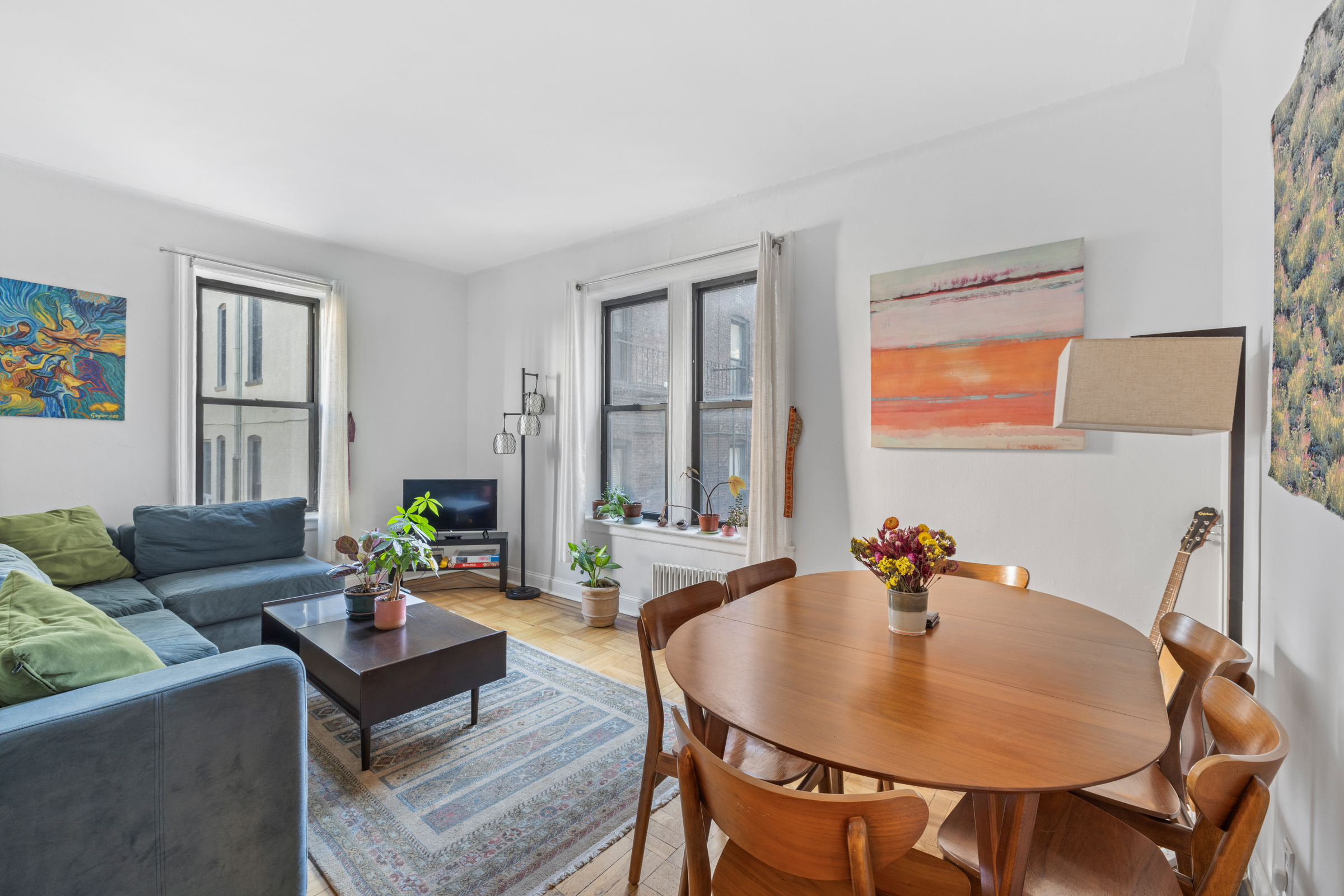 333 4th Street, Unit 2D Brooklyn, NY 11215 - Photo 2 of 7 a living room with furniture and a potted plant