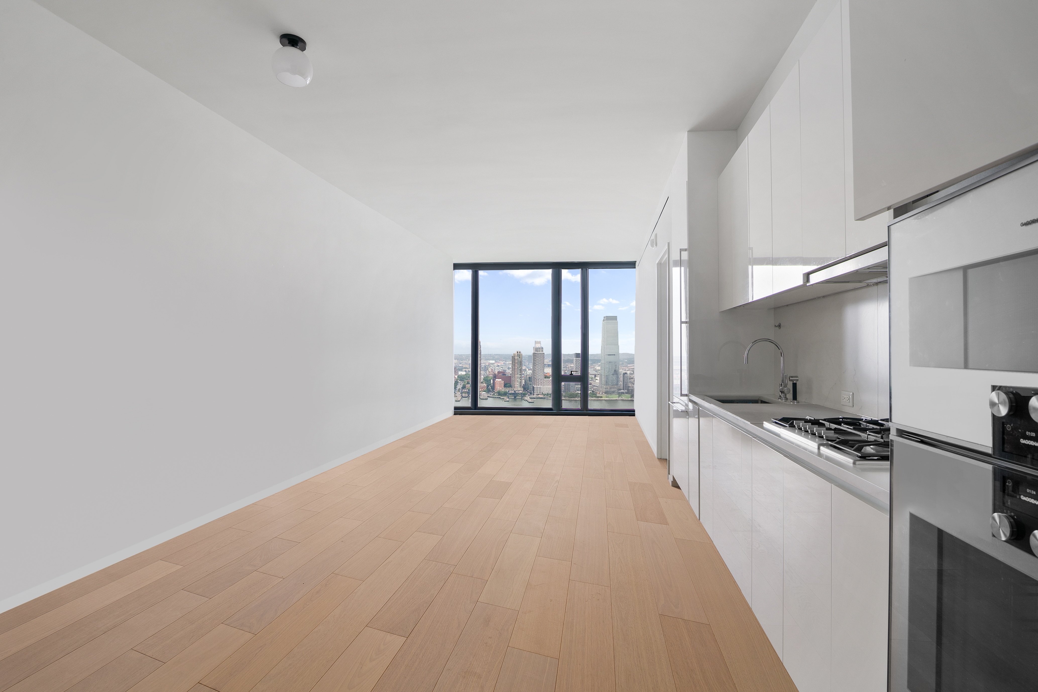 695 1st Avenue, Unit 31C Manhattan, NY 10016 - Photo 8 of 27 a view of a kitchen with a stove top oven