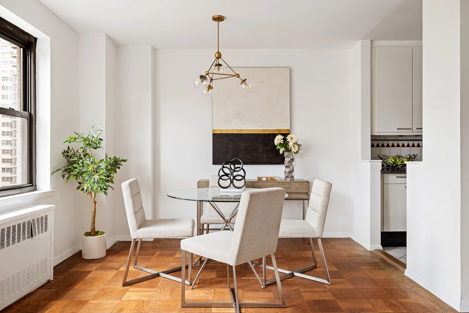 a view of a dining room with furniture and window
