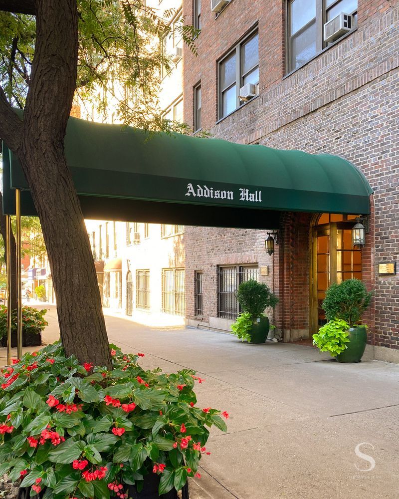 457 West 57th Street, Unit 1102 Manhattan, NY 10019 - Photo 9 of 11 a front view of a house with a yard