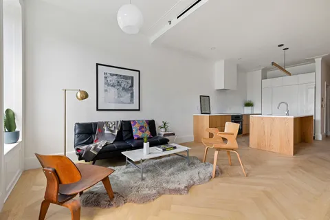 a living room with furniture and a table