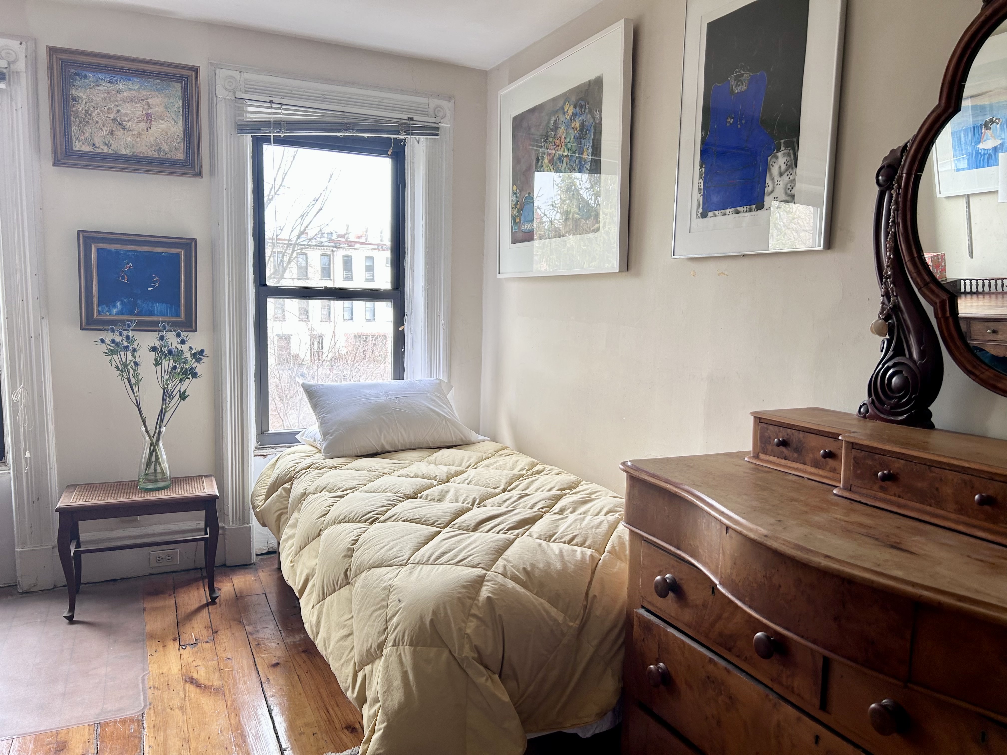 173 Garfield Place Brooklyn, NY 11215 - Photo 10 of 14 a bedroom with a bed and a window