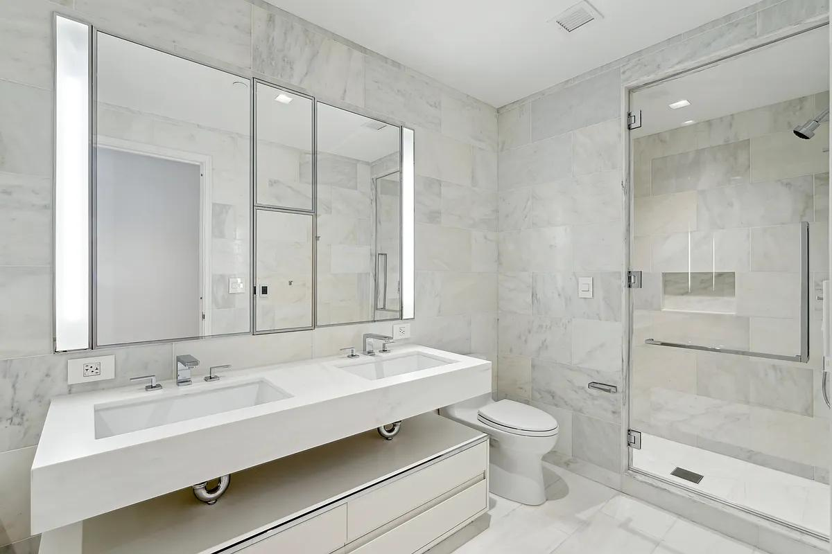 269 West 87th Street, Unit 7B Manhattan, NY 10024 - Photo 7 of 21 a bathroom with a sink toilet and shower