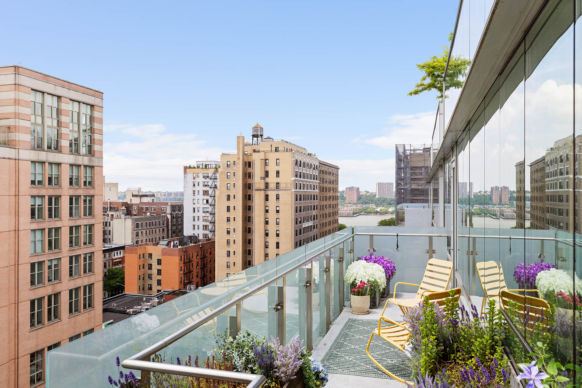 545 West 110th Street, Unit PH11A Manhattan, NY 10025 - Photo 10 of 22 a city view from a balcony with outdoor seating